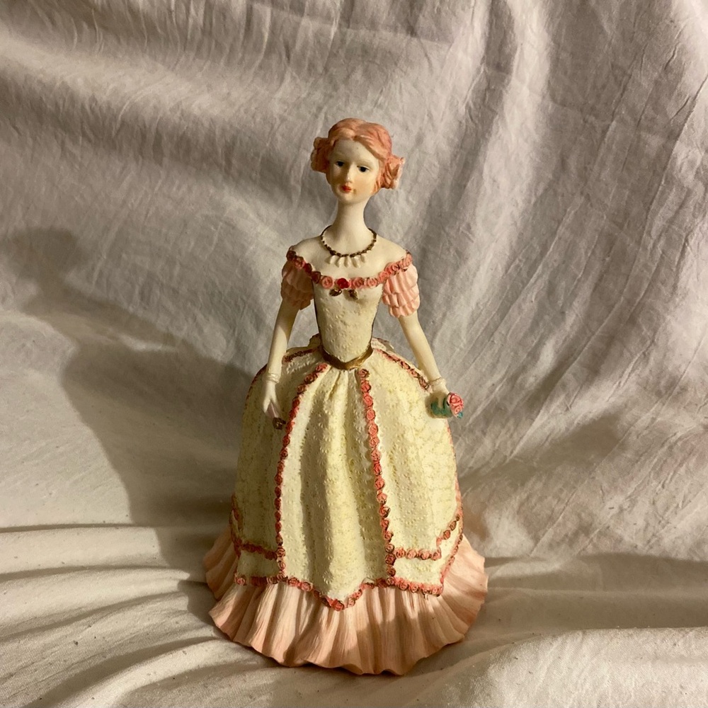 Elegant Pink and Cream Porcelain Figurine